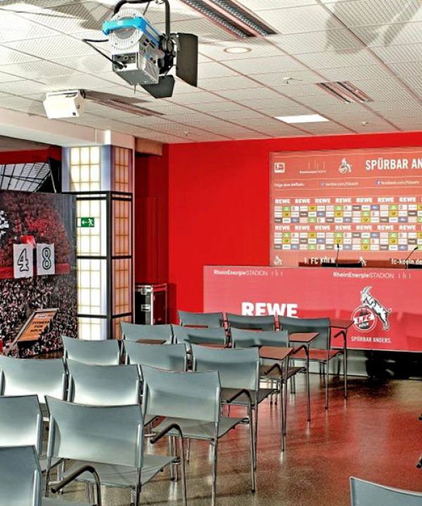 Press conference room at RheinEnergieSTADION with table and chairs